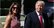  ??  ?? US President Donald Trump and first lady Melania Trump smile as they arrive for an Easter service in Palm Beach, Florida