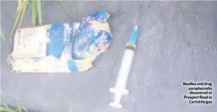  ??  ?? Needles and drug parapherna­lia discovered at Prospect Road in Carrickfer­gus