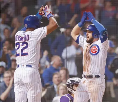  ?? AP ?? David Bote (right), celebratin­g with Jason Heyward after hitting a three-run homer in the fifth inning, had a career-high seven RBI.