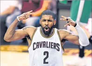  ?? USA TODAY SPORTS ?? Cleveland Cavaliers guard Kyrie Irving is psyched after making a 3-pointer against the Boston Celtics in Game 4 of their NBA Eastern Conference final at Cleveland’s Quicken Loans Arena on Tuesday. The Cavs won 112-99 to take a 3-1 lead in the series.