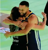  ?? AFP PHOTO ?? ■ Sabrina Ionescu of the New York Liberty and Stephen Curry of the Golden State Warriors embrace after their 3-point challenge during the State Farm All-Star Saturday Night at Lucas Oil Stadium, Saturday, Feb. 17, 2024, in Indianapol­is, Indiana.