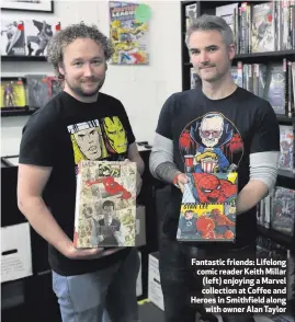  ??  ?? Fantastic friends: Lifelong comic reader Keith Millar (left) enjoying a Marvel collection at Coffee and Heroes in Smithfield alongwith owner Alan Taylor