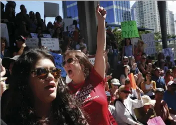  ?? PHOTO/BRYNN ?? Helena Moreno (center) yells during a protest against guns on the steps of the Broward County Federal courthouse in Fort Lauderdale, Fla., on Saturday. Nikolas Cruz, a former student, is charged with killing 17 people at Marjory Stoneman Douglas High...