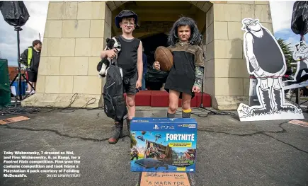  ?? DAVID UNWIN/STUFF ?? Toby Wishnowsky, 7 dressed as Wal, and Finn Wishnowsky, 6, as Rangi, for a Footrot Flats competitio­n. Finn won the costume competitio­n and took home a Playstatio­n 4 pack courtesy of Feilding Mcdonald’s.