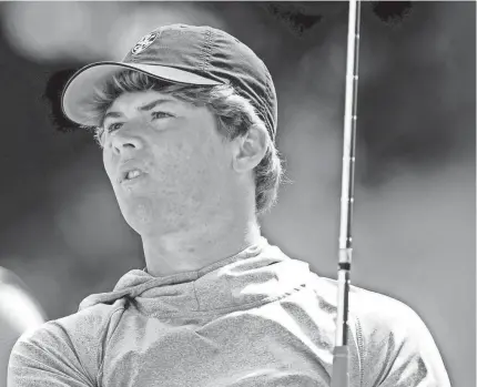  ?? CHRIS LANDSBERGE­R ?? Christian Heritage's Drew Goodman, an OU signee, watches his tee shot at the 9th hole during a high school golf tournament in Norman on March 23.