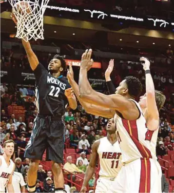  ?? AP PIC ?? Wolves’ Andrew Wiggins (No 22) goes up for a layup during the NBA game against Miami Heat on Friday.