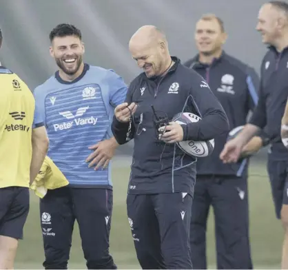  ?? ?? Gregor Townsend shares a smile with his Scotland players during training at Oriam