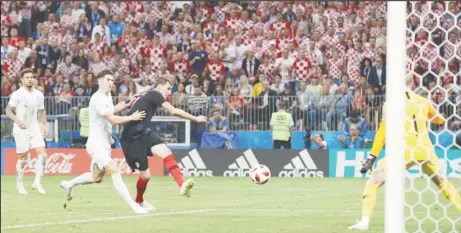  ??  ?? Croatia’s Mario Mandzukic scores the game winner to send his team into Sunday’s final against France. (Reuters photo)