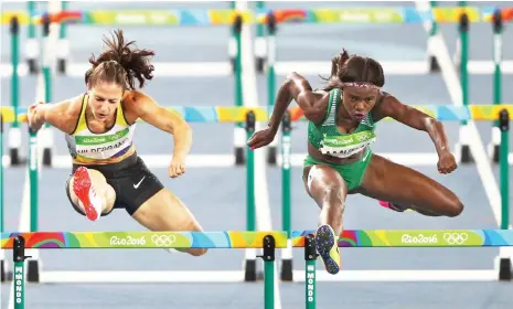  ??  ?? Nigeria’s Oluwatobil­oba Amusan (right) and Germany’s Nadine Hildebrand (left) compete in the 110m hurdles of the 2016 Rio Olympic Games