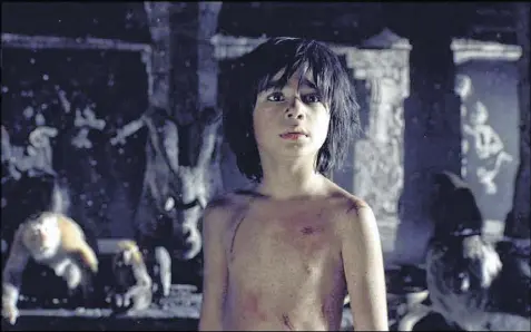  ??  ?? Neel Sethi is an astonishin­gly good newcomer in “The Jungle Book.”