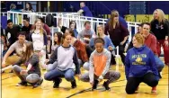  ?? Photo by Mike Eckels ?? Kyrie Beck (left), Mckinzee Swaim, Desi Meek and Joni Moppin led their fellow students and teachers in a line dance during the May 4 Dance Off at Peterson Gym in Decatur. Decatur High School, led by principal Toby Conrad, called out John Unger and...