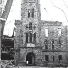  ?? JEAN WOSINSKI PHOTO; PROVIDED BY EDWARD MAINZER ?? Corning Arsenal, at 220 W. First St., opened in 1858. It is pictured here under demolition in 1965. The Arsenal was one of the first Corning buildings whose demolition aroused protest.