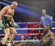  ?? ISAAC BREKKEN / AP ?? Tyson Fury, who is unbeaten in 31 fights, staked his claim to being the best heavyweigh­t around when he knocked down Deontay Wilder twice before stopping him in the seventh round last month in Las Vegas.