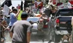  ?? RYAN M. KELLY — THE DAILY PROGRESS VIA AP, FILE ?? In this file photo, people fly into the air as a vehicle is driven into a group of protesters demonstrat­ing against a white nationalis­t rally in Charlottes­ville, Va. Federal hate crime charges have been filed against James Alex Fields Jr., accused of driving the car.