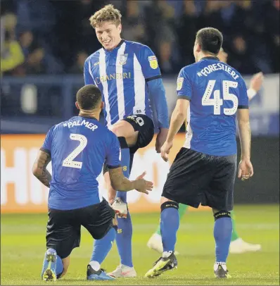  ?? PICTURE: STEVE ELLIS ?? SPIT AND POLISH: Liam Palmer mimmicks polishing Adam Reach’s boot after another wonder strike, but the Owls could not win.