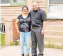 ?? AP ?? In this May 23, 2020 photo, Paulina and Marcos Francisco pose for a photo in front of their house in Sioux City, Iowa. They bought the home after years of working in a meatpackin­g plant and other food-processing jobs.