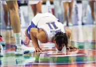  ?? Matt Stamey / Associated Press ?? Florida forward Keyontae Johnson kisses the floor at midcourt after being introduced as a starter before a game against Kentucky on Saturday.
