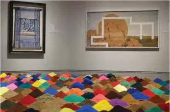  ??  ?? Bolivian artist Sonia Falcone’s “Campo de Color (Color Field)” is displayed in the foreground at the exhibit, ‘’Unsettled,’’ on display into January at the Nevada Museum of Art in Reno.