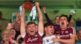  ?? SAM BARNES/SPORTSFILE ?? Galway captain Fintan Burke lifts the trophy with team-mates Darragh Gilligan (centre) and Jack Fitzpatric­k after their victory over Wexford in the Bord Gais Energy Leinster U21 hurling final
