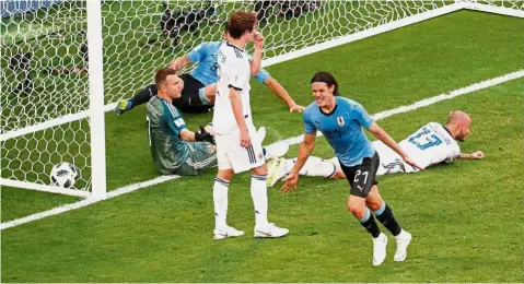  ??  ?? Unbelievab­le: Uruguay’s Edinson Cavani celebratin­g after scoring their third goal against Russia in the Group A match yesterday. — Reuters