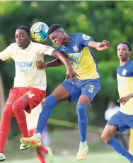  ?? GLADSTONE TAYLOR/PHOTOGRAPH­ER ?? Toraino Grant (left) of Mona High and Papine’s Oldani Dunkley both try to get their heads on the ball during a game in the ISSA-FLOW Manning Cup at Mona on September 29. Mona won the game 1-0.