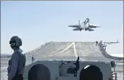  ?? AP ?? A carrier-based J-15 fighter jet takes off from the Chinese Navy’s Liaoning aircraft-carrier during open-sea combat training.