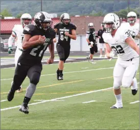  ?? (Messenger photo/Andra Herpst) ?? Jalyn Shelton looks to get past Adairsvill­e linebacker Dakota Hughes. Shelton had 164 yards and four touchdowns as the Ridgeland Panthers crushed the visiting Tigers, 49-7, in Rossville.