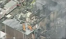  ?? WAVY TV via Reuters ?? Firefighte­rs battle a blaze after the crash of a fighter jet into an apartment complex.