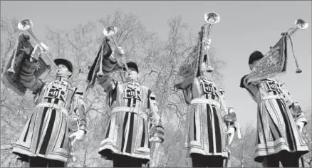  ?? By Kirsty Wiggleswor­th, AP ?? At Wellington Barracks in London: State trumpeters of the Household Cavalry Regiment already are in fine form for the Queen’s Jubilee.