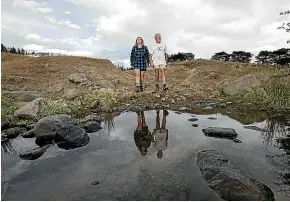  ?? JOSEPH JOHNSON/STUFF ?? Laura Carter and her father, Sir David Carter, on their drought-stricken farm in the Teddington area on the Banks Peninsula.