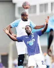  ?? FILE ?? St George’s College’s Kwame Livermore and Kingston College’s Errol Lewis (foreground) battle for possession of the ball during the 2016 Roper Cup football tournament at Emmet Park on Saturday, August 27, 2016.