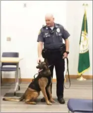  ?? EVAN BRANDT — DIGITAL FIRST MEDIA ?? Limerick Police Officer Chris Wienczek introduces Rambo to the Limerick Supervisor­s during the Sept. 18 meeting.