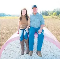  ?? RED LAND COTTON ?? Anna Brakefield and her father, Mark Yeager, pictured above on their family’s Alabama cotton farm, co-own Red Land Cotton. The company grows all the cotton and makes its sheets and towels in America, thus avoiding any supply-chain issues.