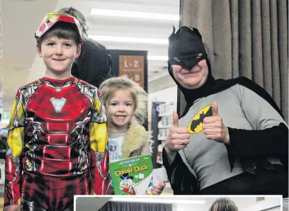  ?? PHOTOS: LUISA GIRAO ?? Looking the part . . . Carter Price (7) and Ava OakleySamo­ns (4) were given a comic book by Greenlight Innovation­s director Leon Hartnett (right) at Free Comic Book Day in Invercargi­ll. Right: Invercargi­ll siblings Dylan (8) and Riley (10) Lowen dressed up as their favourite comic book characters.