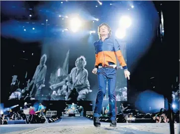  ?? Allen J. Schaben Los Angeles Times ?? MICK JAGGER, shown with the Stones at the recent Desert Trip fest, plays the blues harp on a new album.