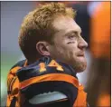  ?? The Canadian Press ?? Tears run down B.C. Lions’ quarterbac­k Travis Lulay’s face after he was injured against the Montreal Alouettes in Vancouver on Friday. The Lions said Tuesday that Lulay is out for the season.