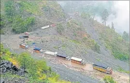  ?? ANI ?? Vehicles stranded on the Jammu-Srinagar national highway after heavy rains triggered multiple landslides in Ramban and Udhampur districts on Wednesday.