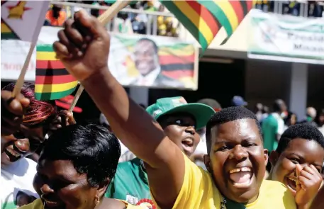  ?? Picture: Reuters/Philimon Bulawayo ?? CHEERS: Supporters of Zimbabwe’s President Emmerson Mnangagwa ululate as he arrives at his presidenti­al inaugurati­on ceremony in Harare, Zimbabwe.