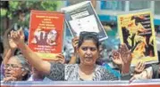  ?? REUTERS ?? People hold placards during a march to protest against atrocities ▪ on women, in Ahmedabad on Friday.