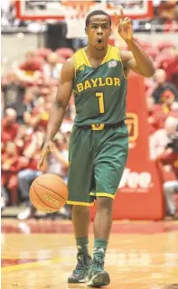  ?? REESE STRICKLAND, USA TODAY SPORTS ?? Point guard Kenny Chery, above, runs the show for Baylor, which has won seven of its last eight games. Coach Dana Altman, left, watched Oregon (22-8) start 3-8 in Pac-12 play before turning things around.