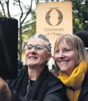  ?? PHOTO: STEPHEN JAQUIERY ?? Smile of approval . . . University of Otago staff members Tui Kent (left) and Lisa Kremer take a selfie after the unveiling of the university’s new branding.
