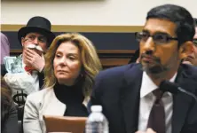  ?? Ting Shen / New York Times ?? Protester dressed as Monopoly game character is in back row as Sundar Pichai, Google’s CEO, testified before Congress.