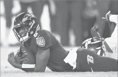  ?? NICK WASS/AP ?? Ravens quarterbac­k Lamar Jackson reacts while scrambling for yardage against the Jets on Thursday night in Baltimore’s win.