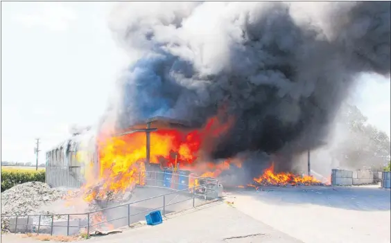  ?? Photo / Dean Taylor ?? The Pa¯ terangi Rd recycling transfer station was well ablaze before the fire brigade arrived.