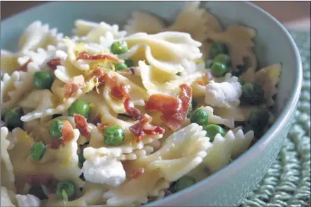  ?? JENNIFER CHANDLER/SPECIAL TO THE COMMERCIAL APPEAL ?? Medium to smaller size pasta shapes such as bowties catch all of the ingredient­s, bringing together the sweet green peas and salty prosciutto for a perfect bite every time. This dish is delicious any time of year.