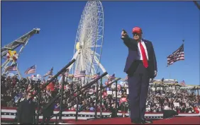  ?? MATT ROURKE/ AP ?? Republican presidenti­al candidate Donald Trump gestures to the crowd during a campaign rally in Wildwood, N.J., on Saturday.