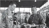  ??  ?? US DELIVERS COUNTER-TERRORISM EQUIPMENT TO PHILIPPINE MARINES
Representa­tives from the US Embassy in the Philippine­s’ Joint U.S. Military Assistance Group (JUSMAG) delivered 24 pallets of new military equipment to the Philippine Marine Special...
