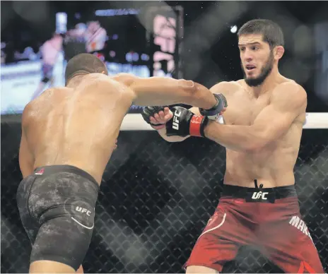  ?? Chris Whiteoak / The National ?? Islam Makhachev, right, during his win over Davi Ramos at UFC 242 on Yas Island in September 2019