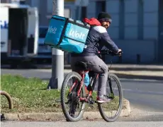  ?? ?? A Nepali worker delivers food for Wolt on a bicycle, in Zagreb, Croatia.
