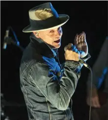  ?? The Canadian Press ?? Gord Downie performs on stage in Toronto in 2016. Downie, the poetic lead singer of the Tragically Hip died on Tuesday. He was 53.